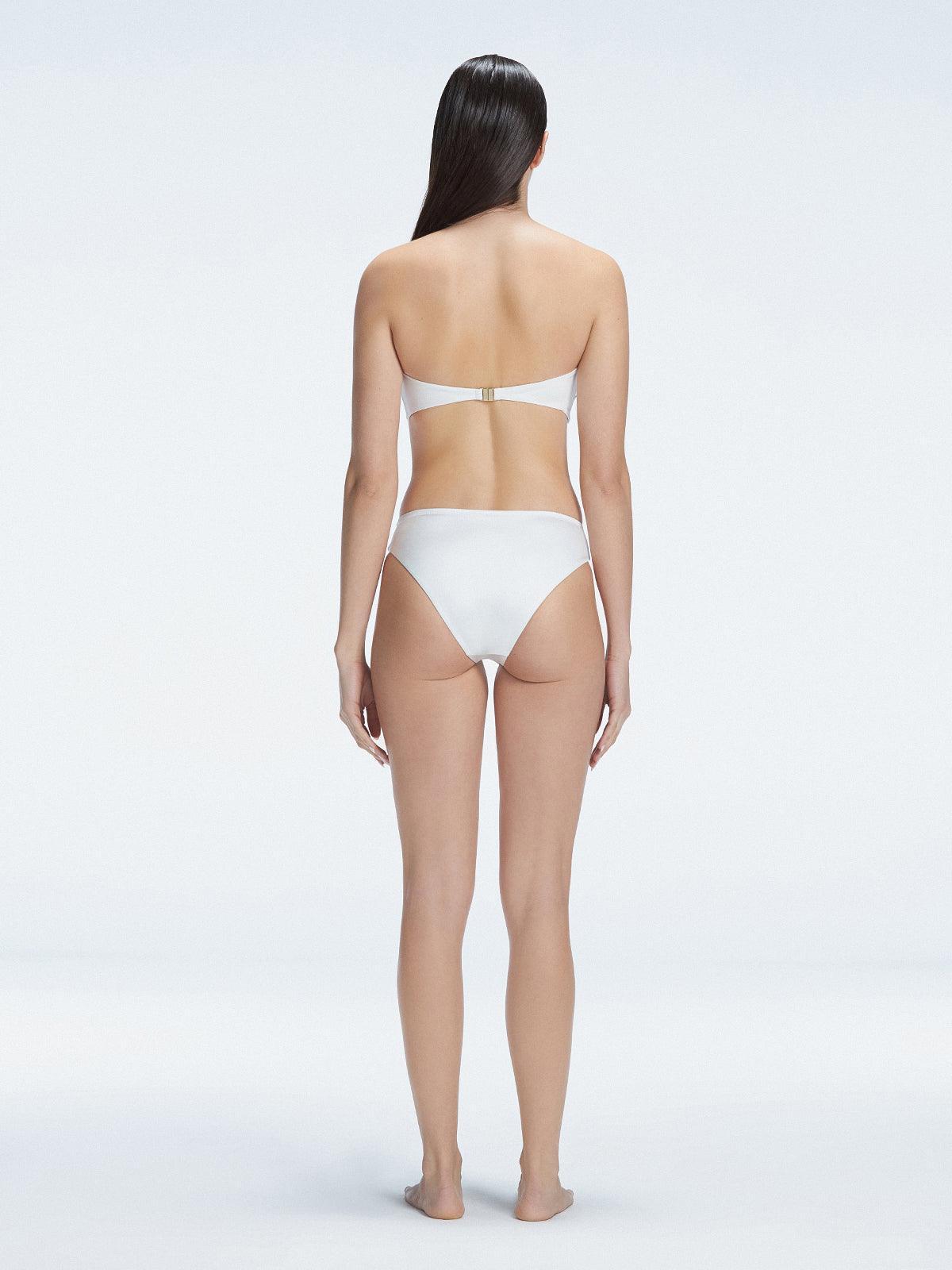 "Model wearing the Ilana White  Bikini Set from the back, showcasing the elegant bandeau design and adjustable straps."

