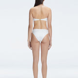 "Model wearing the IlanaWhite  Bikini Bottom from the back, showcasing the elegant bandeau design and adjustable straps."

