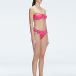 "Model in the Ilana Gradient Bikini Top viewed from the side, highlighting the stylish buckle detail and ruched accents."

