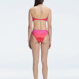 "Model wearing the Ilana Gradient  Bikini Top from the back, showcasing the elegant bandeau design and adjustable straps."

