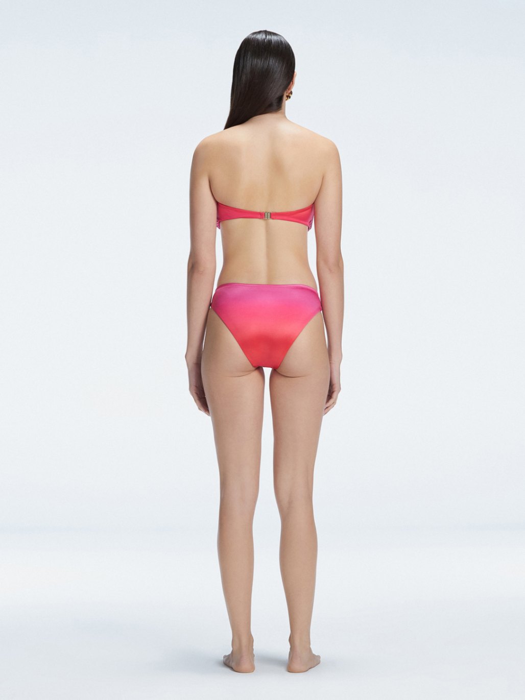 "Model wearing the Ilana Gradient  Bikini Set from the back, showcasing the elegant bandeau design and adjustable straps."

