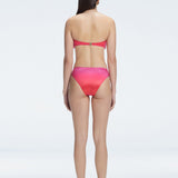 "Model wearing the Ilana Gradient  Bikini Set from the back, showcasing the elegant bandeau design and adjustable straps."

