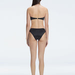 "Model wearing the Ilana Black Bikini Set  from the back, showcasing the elegant bandeau design and adjustable straps."

