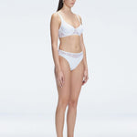 "Side view of the mesh detailing on the Lorelai White Bikini Set , emphasizing its chic aesthetic."
