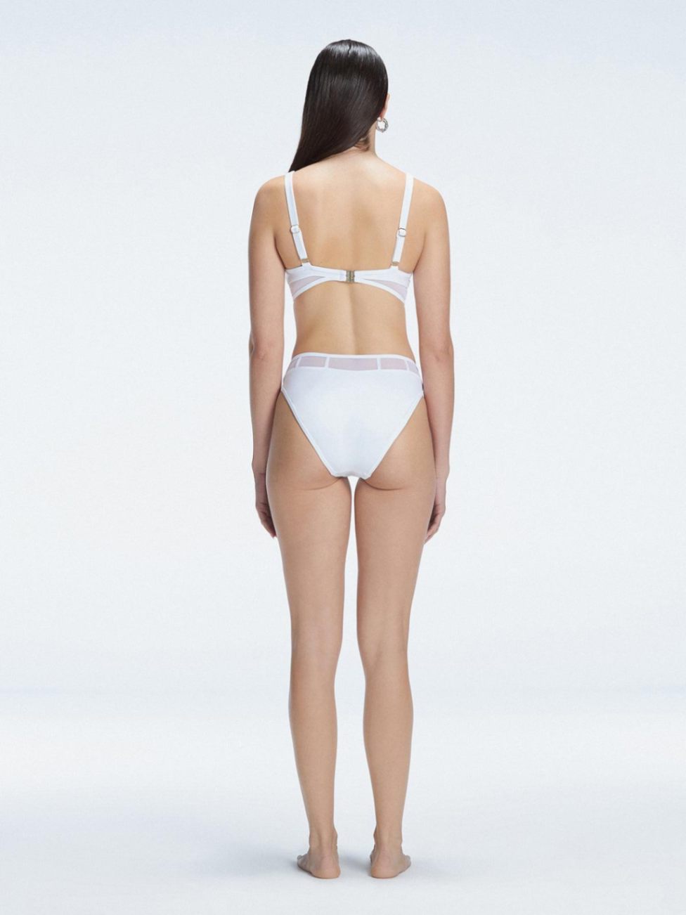 "Model showcasing the back of the Lorelai White Bikini Set , highlighting the comfortable fit and stylish design."
