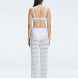 Back view of model wearing Elysia White Wide-Leg Pants, highlighting the relaxed fit and low-rise design.
