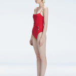 "Side view of the Marigold Red Swimsuit’s square neckline and boned torso, emphasizing its luxurious design."
