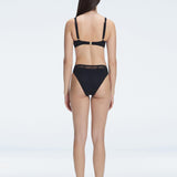 "Model showcasing the back of the Lorelai Black Bikini Top, highlighting the adjustable straps and comfortable fit."
