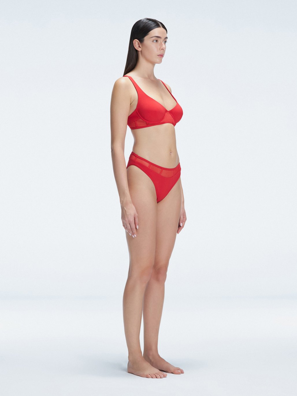 "Side view of the mesh detailing and scoop neck on the Lorelai Red Bikini Top, emphasizing its stylish design."
