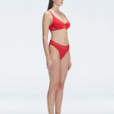 "Side view of the mesh detailing and scoop neck on the Lorelai Red Bikini Top, emphasizing its stylish design."
