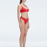 "Side view of the mesh detailing on the Lorelai Red Bikini Set , emphasizing its chic aesthetic."
