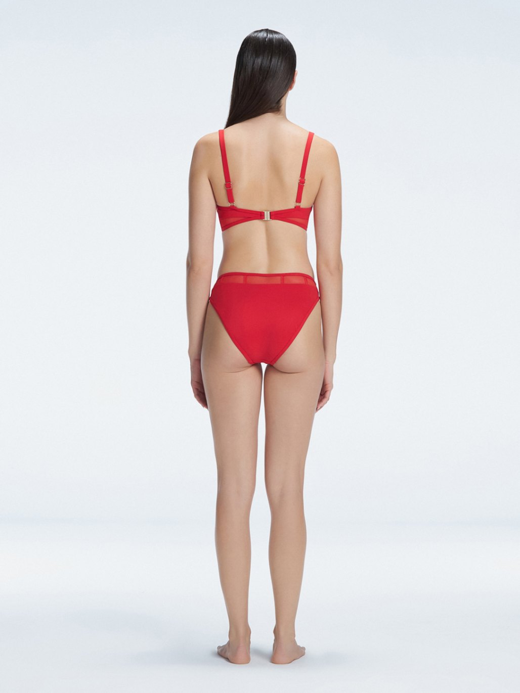 "Model showcasing the back of the Lorelai White Red Set , highlighting the comfortable fit and stylish design."
