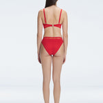 "Model showcasing the back of the Lorelai White Red Set , highlighting the comfortable fit and stylish design."
