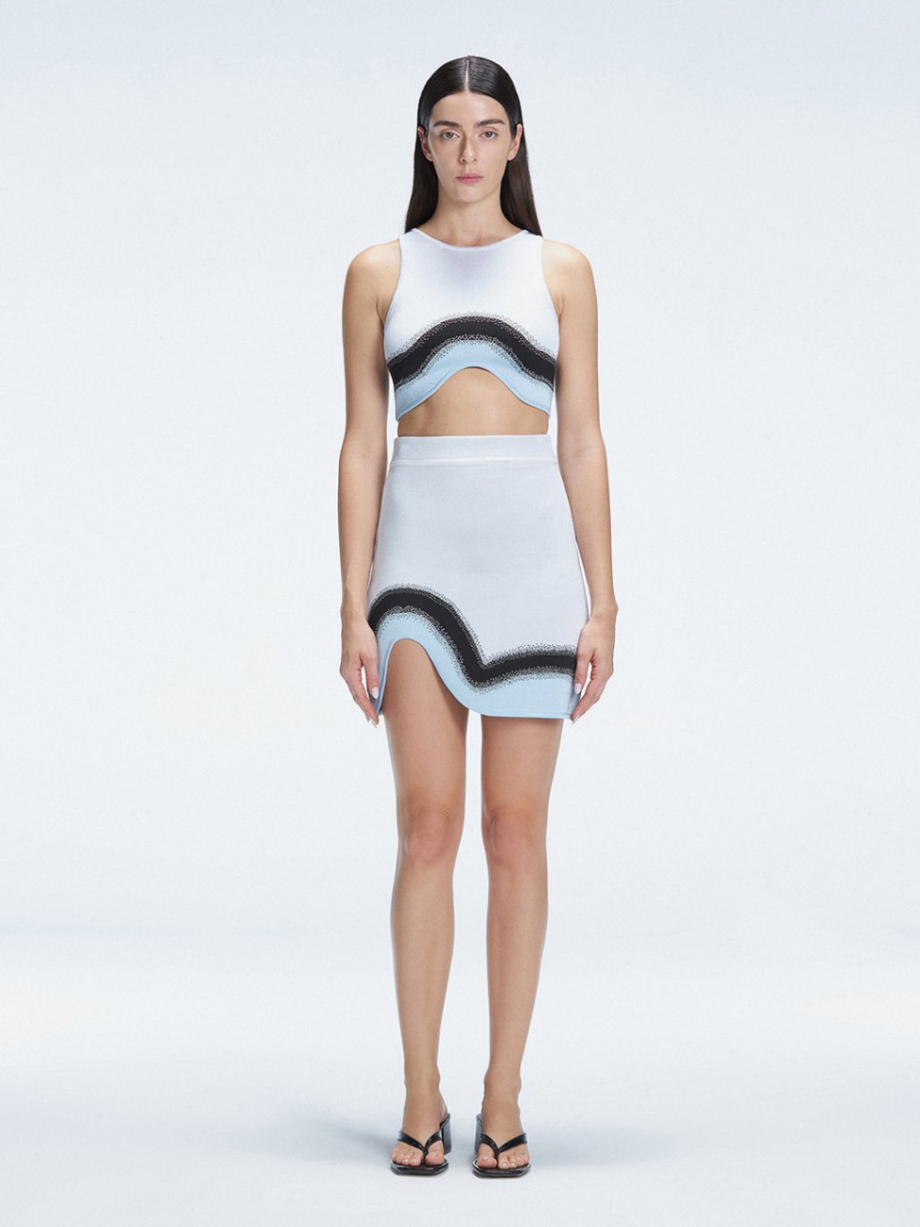 Model showcasing the Lydia Blue Degraded Skirt, highlighting its stylish asymmetrical design.