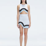 Model showcasing the Lydia Blue Degraded Skirt, highlighting its stylish asymmetrical design.