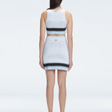 Back view of the asymmetrical hemline of the Lydia Mini Skirt, illustrating its modern design