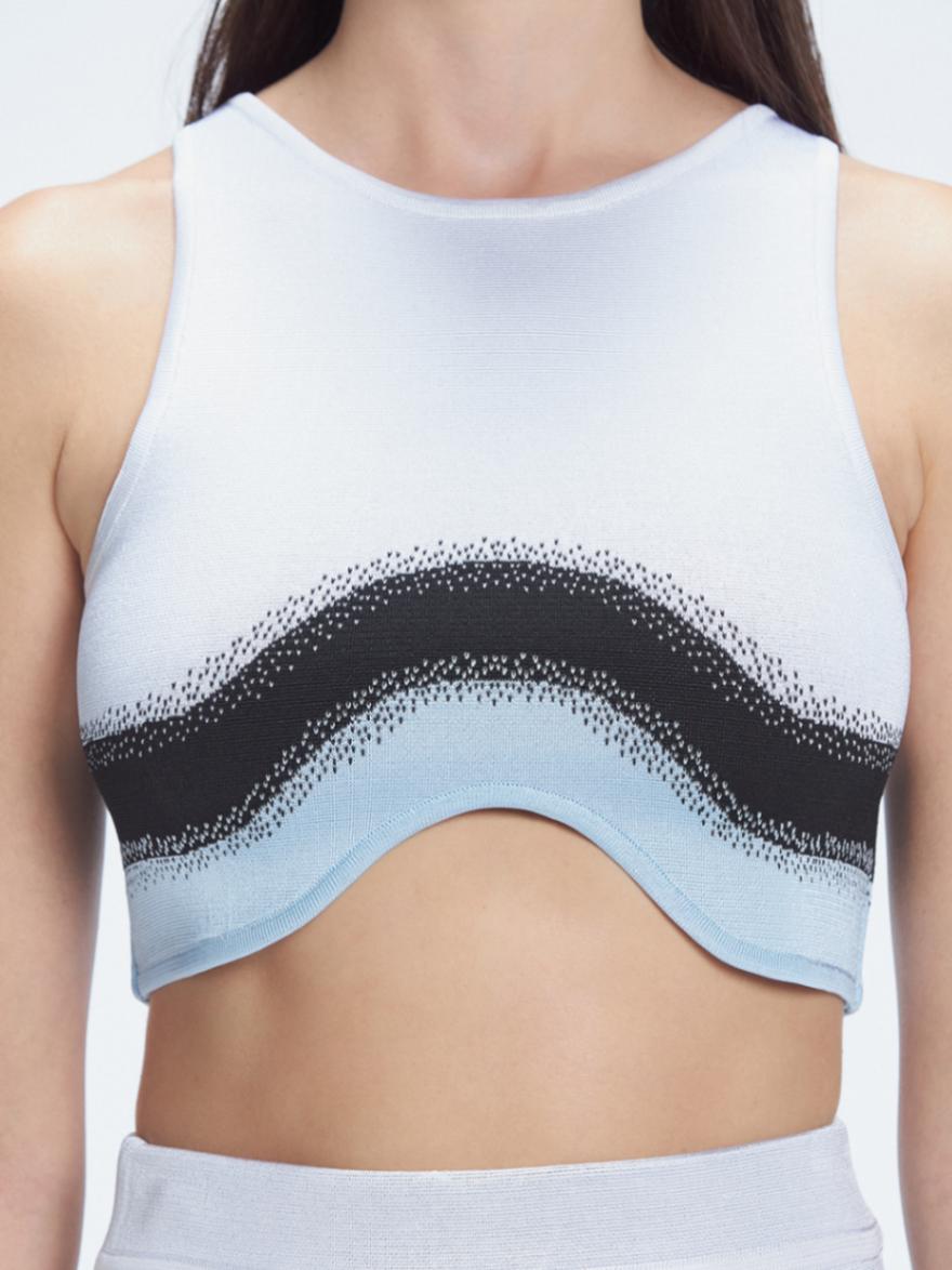 Back view  of the soft fabric of the Cecilia Knitwear Crop Top, emphasizing its white, black, and blue hues.