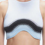 Back view  of the soft fabric of the Cecilia Knitwear Crop Top, emphasizing its white, black, and blue hues.