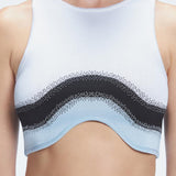 Back view  of the soft fabric of the Cecilia Knitwear Crop Top, emphasizing its white, black, and blue hues.