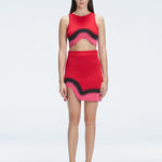 Model showcasing the Cecilia Red Degraded Crop Top and Lydia Skirt Set highlighting its vibrant multicolored pattern.