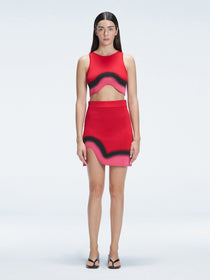 Model showcasing the Cecilia Red Degraded Crop Top and Lydia Skirt Set highlighting its vibrant multicolored pattern.