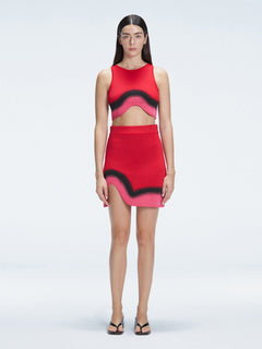 Model showcasing the Cecilia Red Degraded Crop Top and Lydia Skirt Set highlighting its vibrant multicolored pattern.
