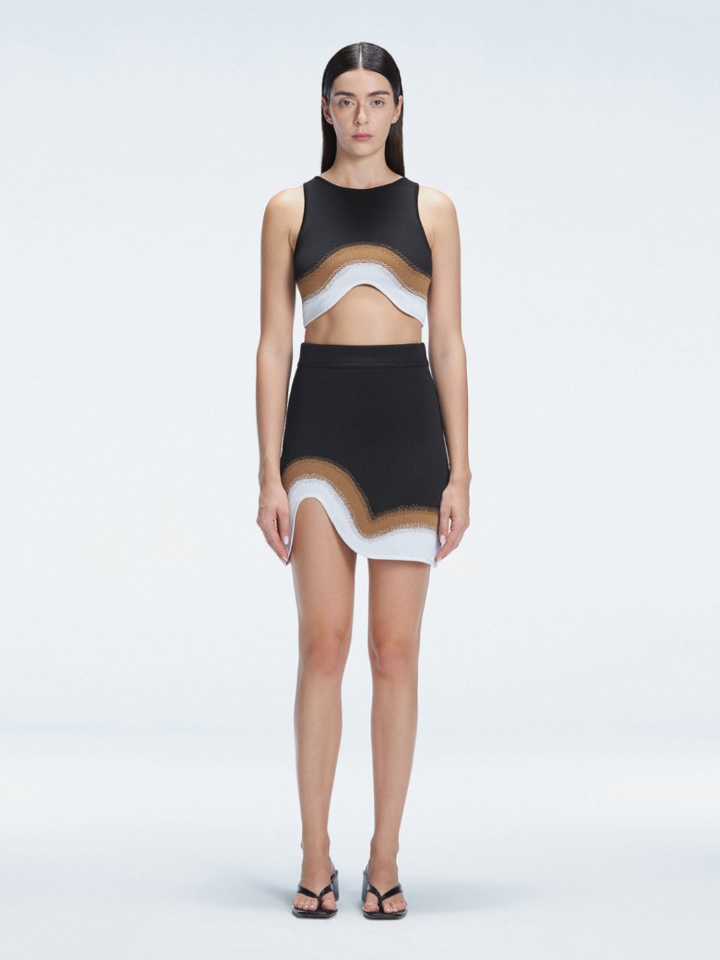 Model showcasing the Lydia Black Degraded Skirt, highlighting its stylish asymmetrical design.