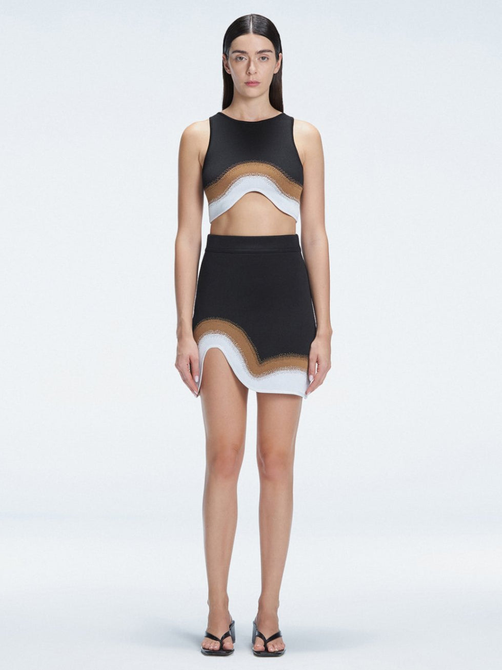 Lydia Black Optical Knit Mini Skirt | Moeva | Skirt | Each week unveils new pieces—luxury swimwear, fluid resort silhouettes, and elevated summer-to-evening essentials designed to carry you from coastal escapes to city nights.