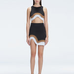 Model showcasing the Lydia Black Degraded Skirt, highlighting its stylish asymmetrical design.