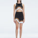 Model showcasing the Lydia Black Degraded Skirt, highlighting its stylish asymmetrical design.