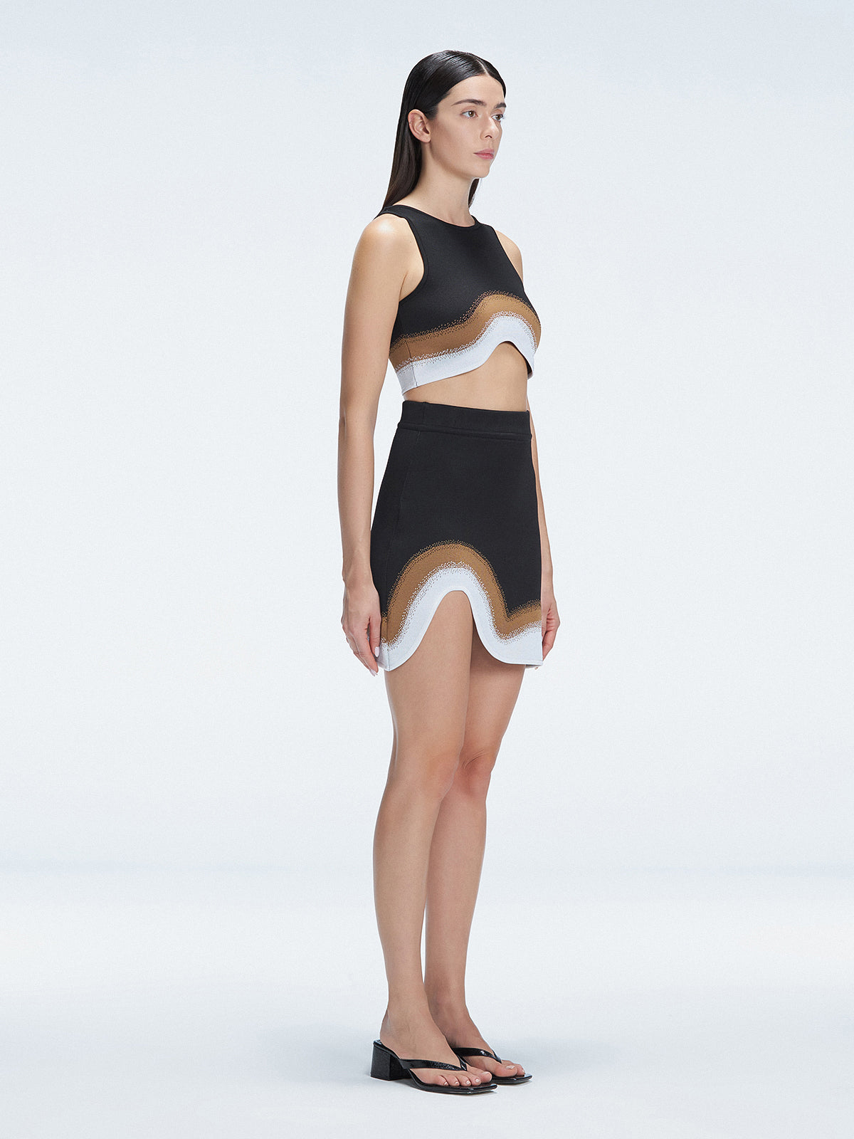 Side view of the Cecilia Black Degraded Crop Top, showcasing its sleeveless design and stylish silhouette.