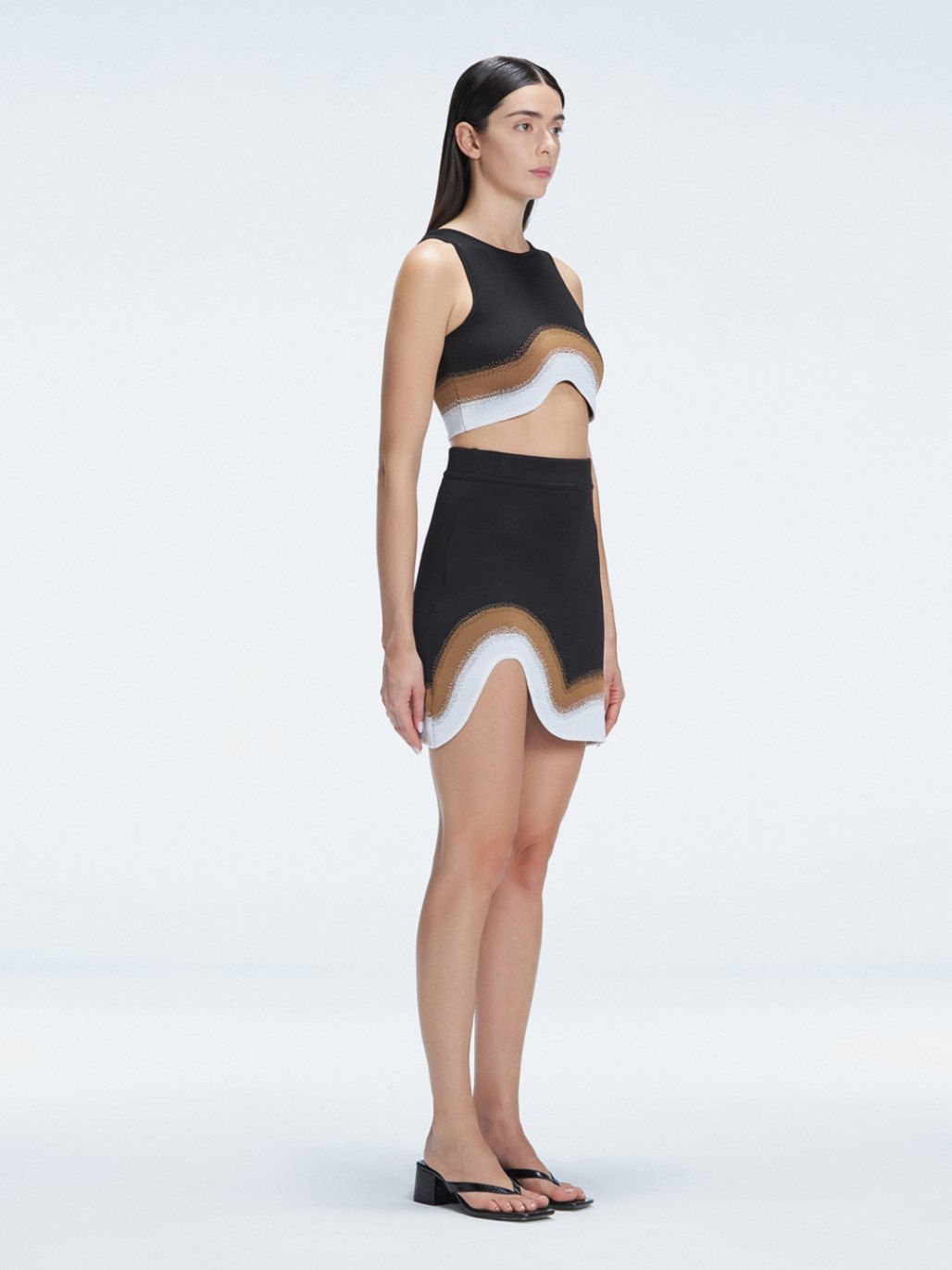 Side view of the Lydia Black Degraded Skirt, emphasizing its unique asymmetrical shape.