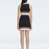 Back view  of the soft fabric of the Cecilia Knitwear Crop Top, emphasizing its white, black, and blue hues.