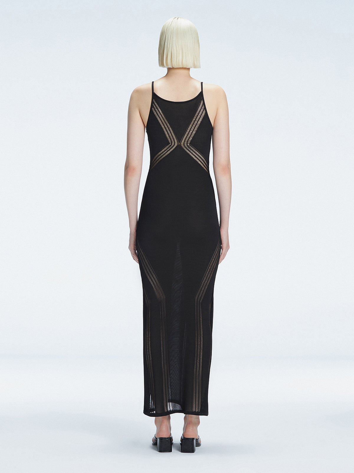 Back view of the Odessa Black Reversible Dress, illustrating its sleek and sophisticated silhouette.