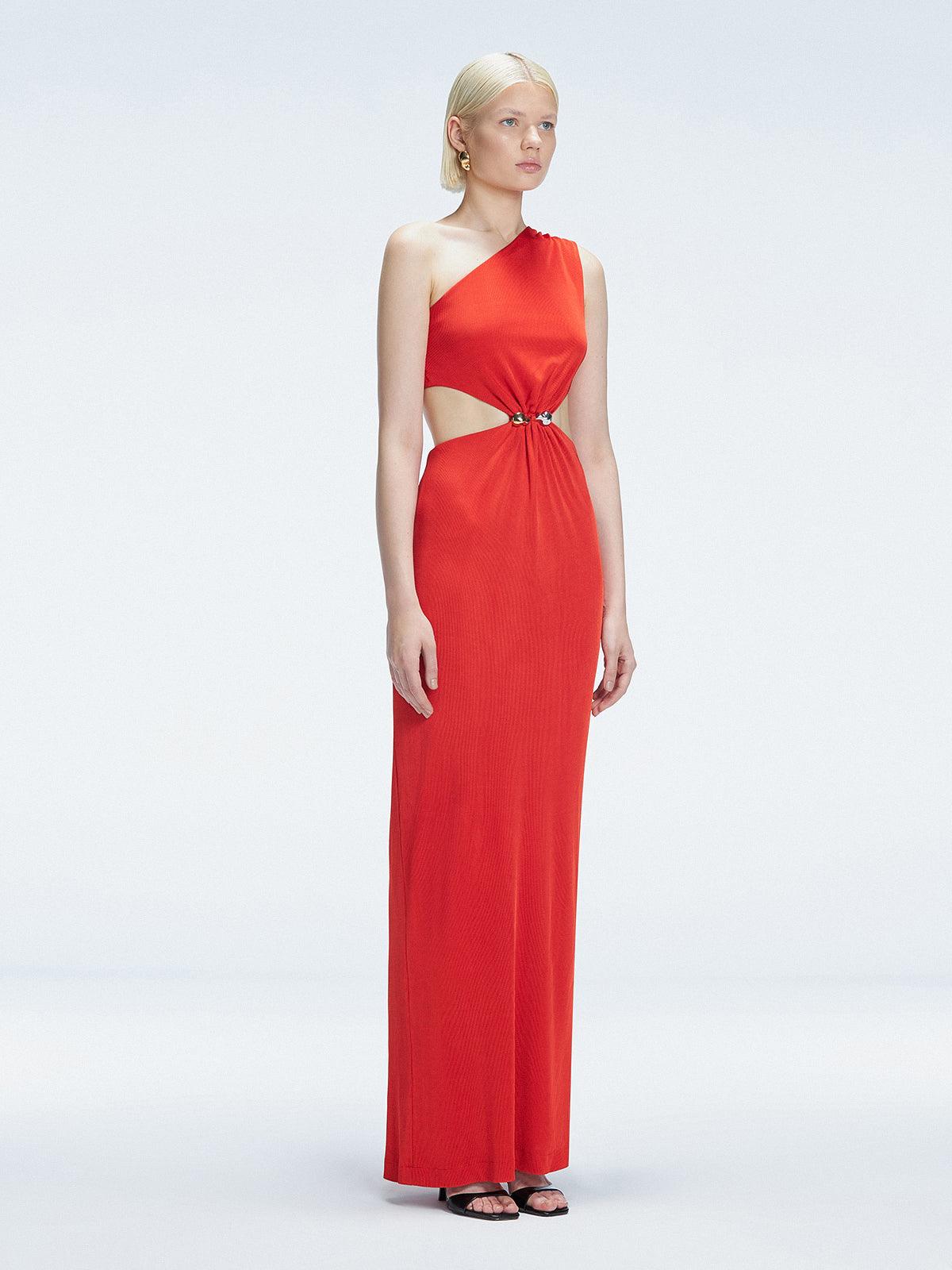 Side view of model showcasing the dramatic side slit and ruched front on the Violet Red Dress.
