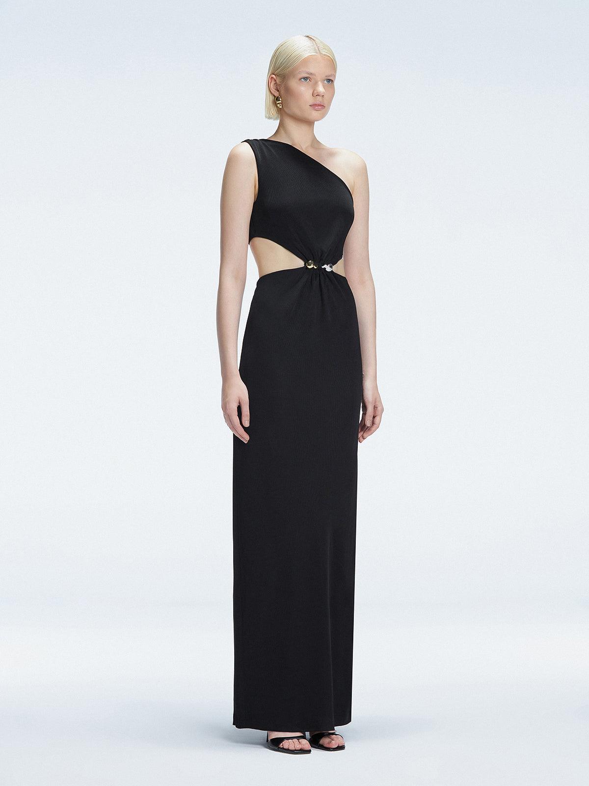 Side view of model showcasing the dramatic side slit and ruched front on the Violet Black Dress.
