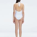 Back view of model wearing Rosamund White One Piece swimsuit, highlighting the low back and full bottom coverage.
