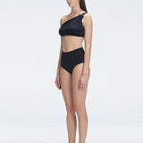 "Side view of the matte satin contrast on the Romina Black Bikini Set , emphasizing its elegant, sophisticated design."
