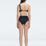 "Model showing the back of the Romina Black Bikini Bottom, highlighting the high-waist fit and sleek design."
