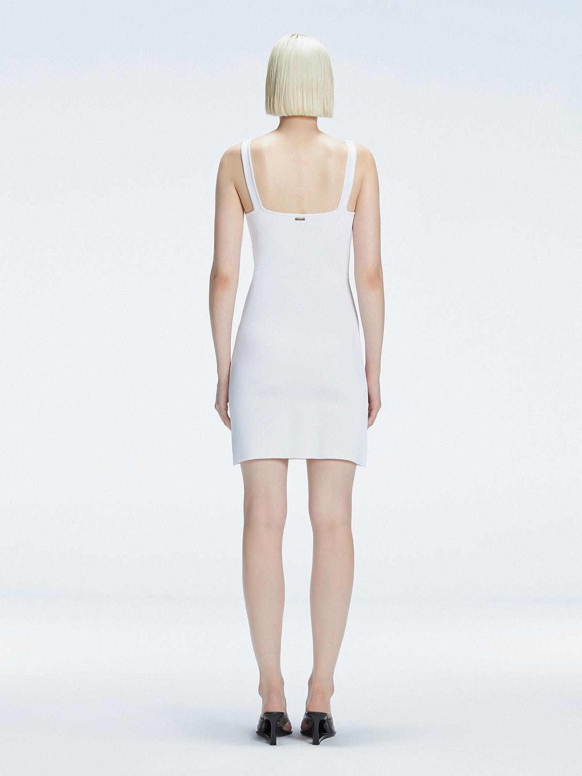 Back view of model wearing Heather White Dress, highlighting the sleek silhouette and adjustable straps.
