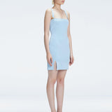 Side view of model showcasing the chic buckle accents and front slit on the Heather Baby Blue Mini Dress.
