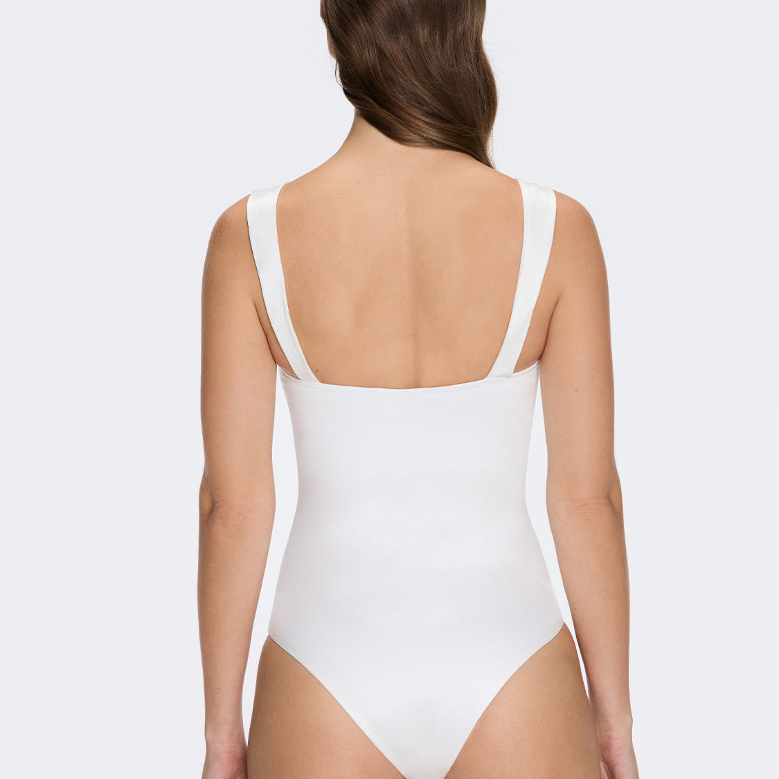 Talia V Neck with Gold Detail Satin White Swimsuit | Moeva | Swimsuit | Each week unveils new pieces—luxury swimwear, fluid resort silhouettes, and elevated summer-to-evening essentials designed to carry you from coastal escapes to city nights.