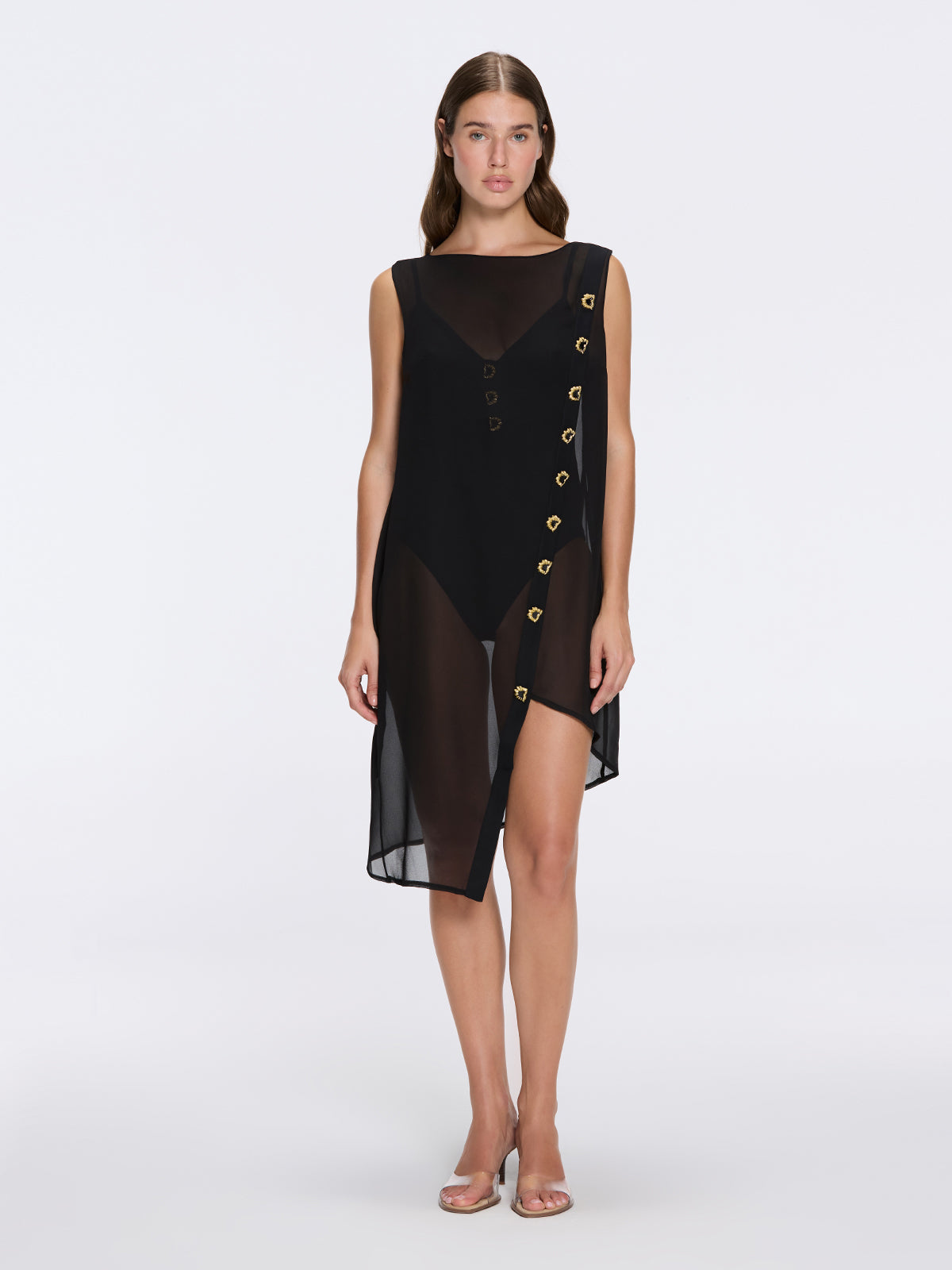 Solianne Black Sheer Sleeveless Asymmetric Dress with Gold Button Detail | Moeva | Dress | Each week unveils new pieces—luxury swimwear, fluid resort silhouettes, and elevated summer-to-evening essentials designed to carry you from coastal escapes to city nights.
