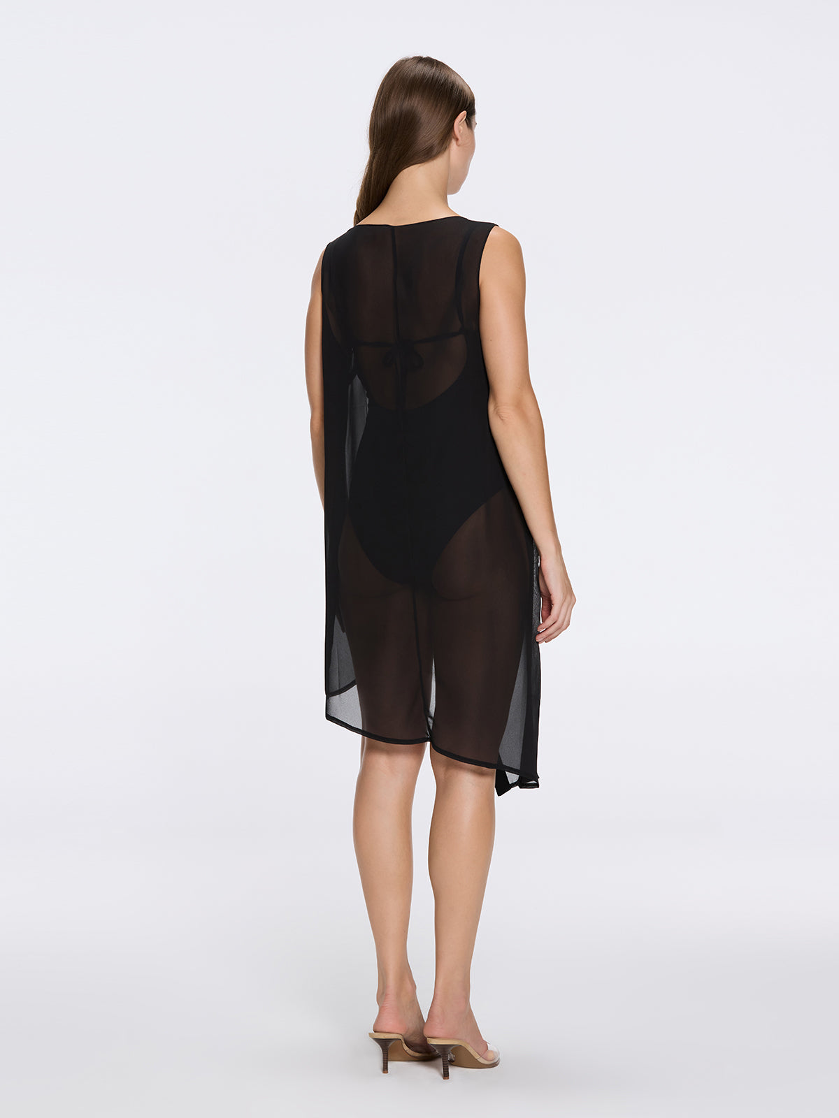 Solianne Black Sheer Sleeveless Asymmetric Dress with Gold Button Detail | Moeva | Dress | Each week unveils new pieces—luxury swimwear, fluid resort silhouettes, and elevated summer-to-evening essentials designed to carry you from coastal escapes to city nights.