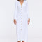 Brezia White Knitted Maxi Dress with Long Sleeves and Gold Button Details | Moeva | RTW Dresses | Each week unveils new pieces—luxury swimwear, fluid resort silhouettes, and elevated summer-to-evening essentials designed to carry you from coastal escapes to city nights.