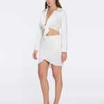 Greta White Satin Long Sleeve Tie Front Shirt | Moeva | Beachwear Tops | Each week unveils new pieces—luxury swimwear, fluid resort silhouettes, and elevated summer-to-evening essentials designed to carry you from coastal escapes to city nights.