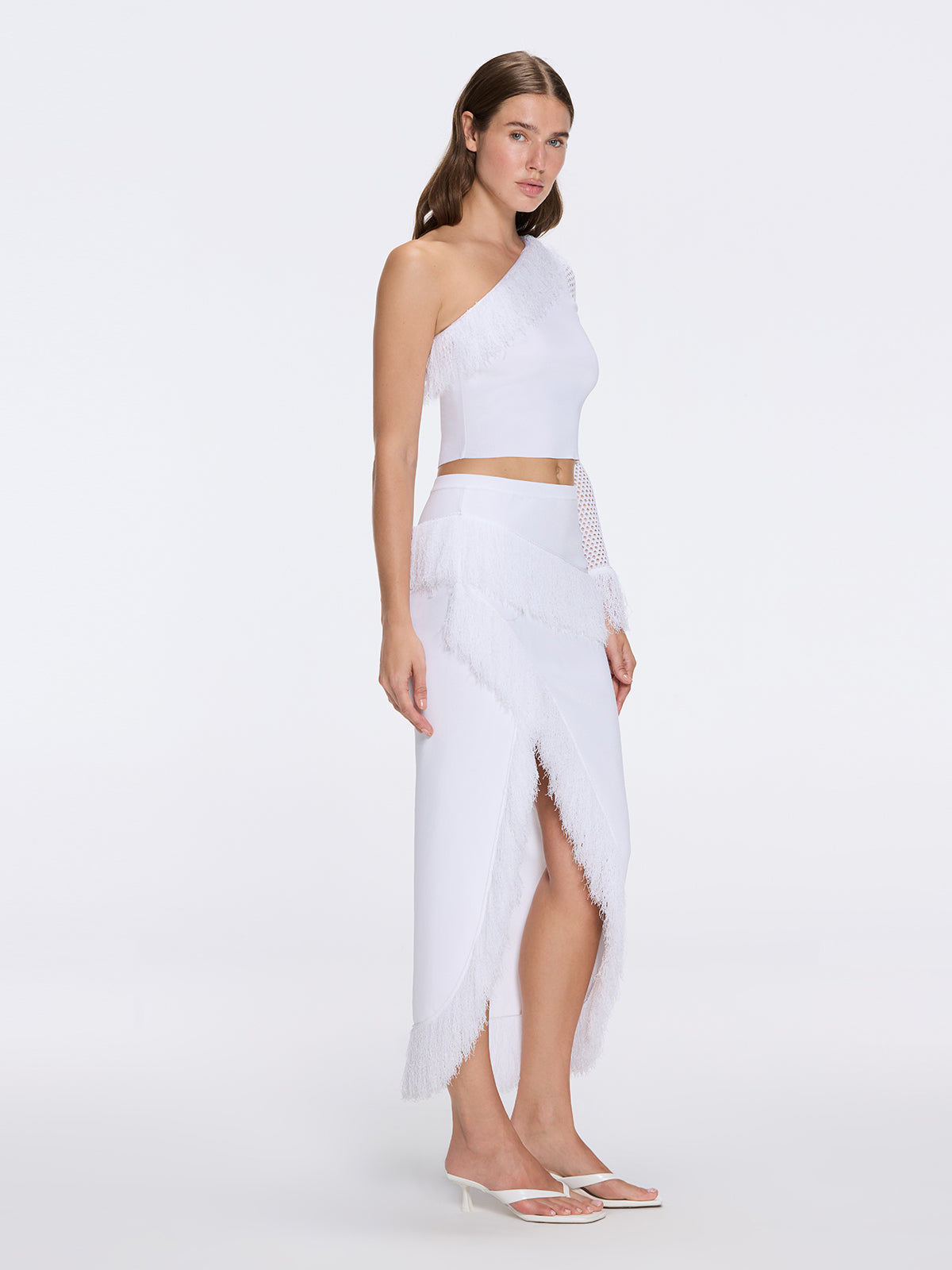 Monroe & Alani Fringe Asymmetric Knit White Set | Moeva | | Each week unveils new pieces—luxury swimwear, fluid resort silhouettes, and elevated summer-to-evening essentials designed to carry you from coastal escapes to city nights.