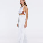 Manami White High Waist Wide Leg Pants | Moeva | Women RTW Pants | Each week unveils new pieces—luxury swimwear, fluid resort silhouettes, and elevated summer-to-evening essentials designed to carry you from coastal escapes to city nights.