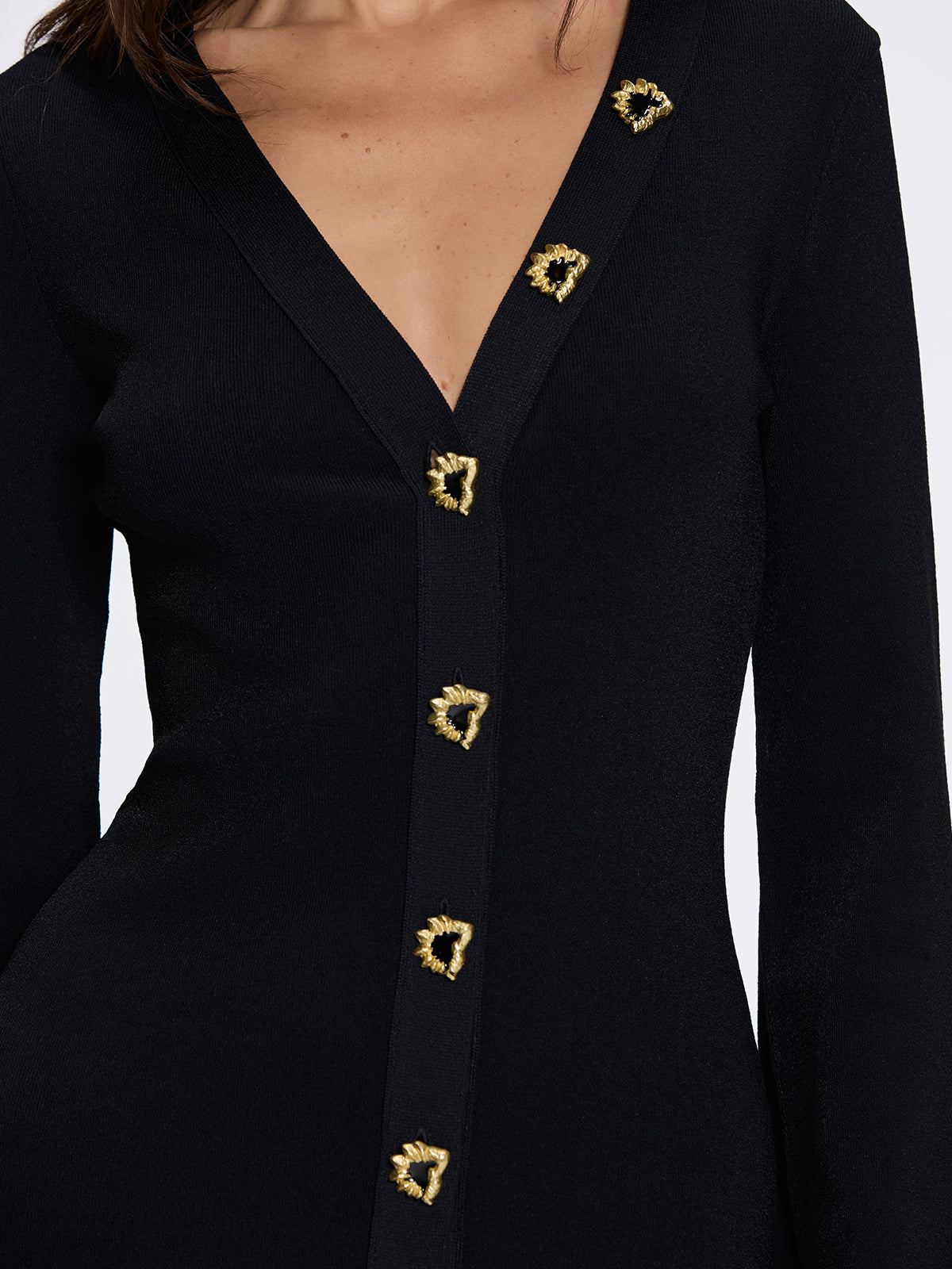 Brezia Black Knitted Maxi Dress with Long Sleeves and Gold Button Details | Moeva | RTW Dresses | Each week unveils new pieces—luxury swimwear, fluid resort silhouettes, and elevated summer-to-evening essentials designed to carry you from coastal escapes to city nights.