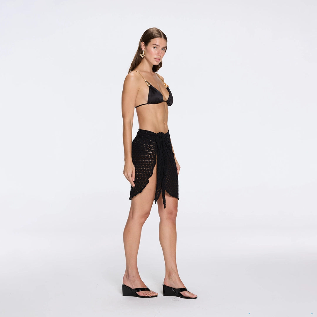Dalina Mini Mesh Wrap Black Sarong | Moeva | Beachwear Skirts | Each week unveils new pieces—luxury swimwear, fluid resort silhouettes, and elevated summer-to-evening essentials designed to carry you from coastal escapes to city nights.